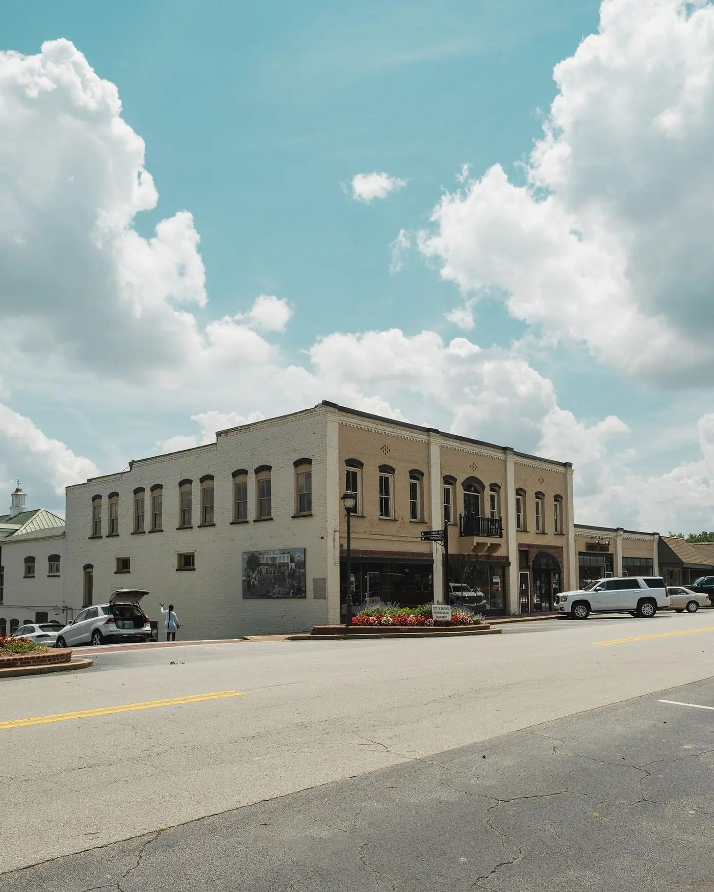 Historic American main street commercial building row with retail storefronts and awnings